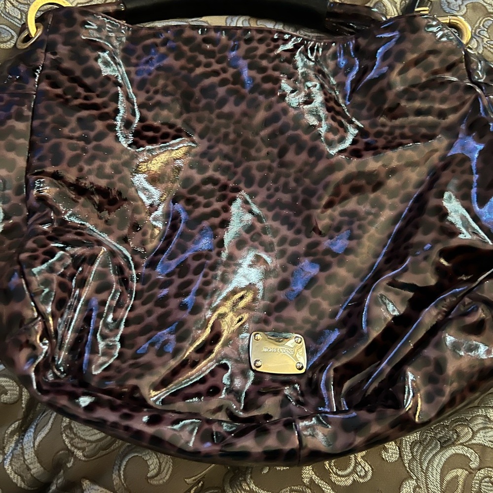 Authentic Jimmy Choo handbag. Has some small pen marks inside,